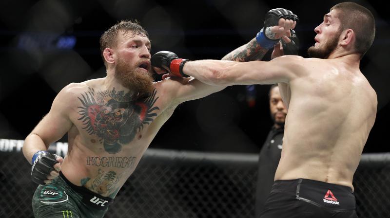 McGregor managed to roll away briefly before Nurmagomedov ended up in a full mount, getting him in a brutal rear-naked chokehold that had McGregor tapping out at 3min 3sec of the round. (Photo: AP)