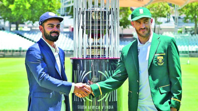 Virat Kohli (left) and Faf du Plessis pose with the Freedom Trophy ahead of their Test series. (Photo: BCCI)