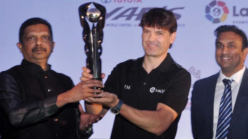 Former Spanish footballer Fernando Morientes unveils the trophy for international pre-season tournament to be held in Kochi in July along with Nippon Toyota chairman, M.A.M Babu Moopan. (Photo: SUNOJ NINAN MATHEW)