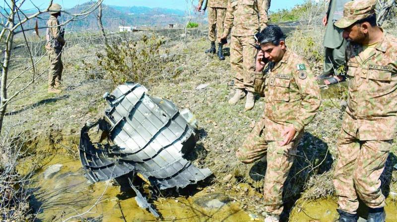 caught in the lie | The commanding officers of Pakistans 7 Northern Light Infantry assess the damage done to their F-16 downed by an Indian MiG.  Sources in the IAF said that this picture is being falsely circulated by the Pakistan Army as debris belonging to the MiG.