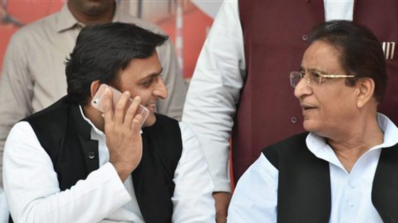 Uttar Pradesh Chief Minister and newly appointed party president Akhilesh Yadav with party leader Azam Khan. (Photo: PTI)