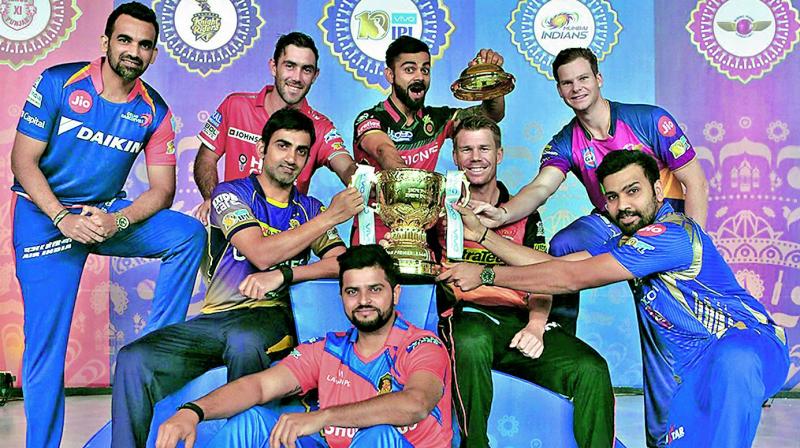Captains of IPL teams pose with the trophy on the eve of the 10th edition of the tournament starting on Wednesday. (Photo: BCCI)