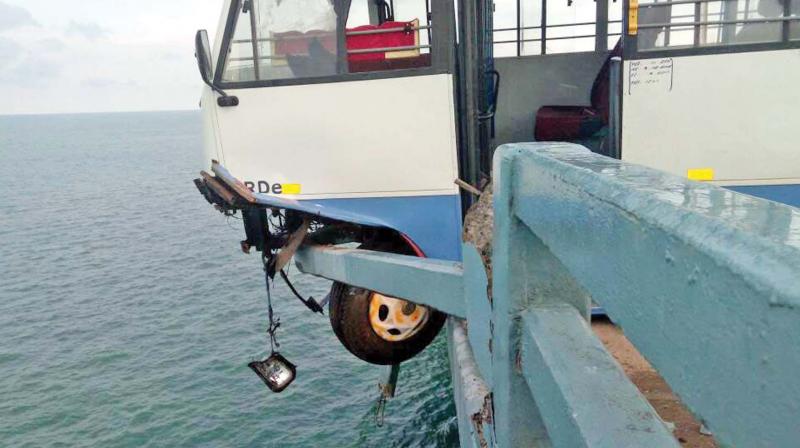 The pilgrims had a miraculous escape on Sunday as the mini-bus they were traveling in crashed into the cement railing of the Pamban road bridge over the sea in Rameswaram on Sunday. (Photo: DC)