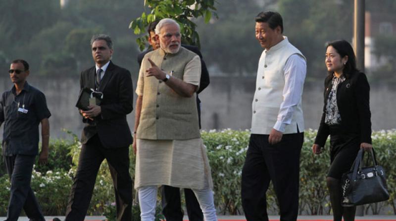 Prime Minister Narendra Modi talks to Chinese President Xi Jinping. (Photo: AP)