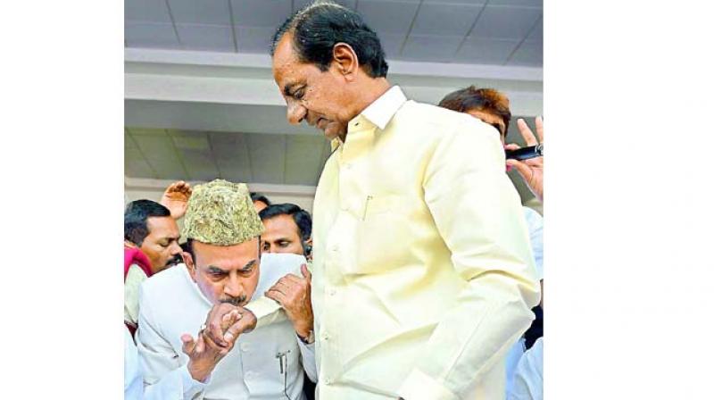 Mohammad Mahmood Ali, the first deputy Chief Minister of Telangana kisses hand of K. Chandrasekhar Rao.