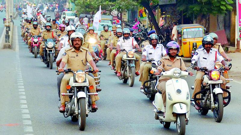 Urban SP B. Raja Kumar leads a two-wheeler rally to create awareness on Road Safety in Rajahmundry on Friday. (Photo: DC)