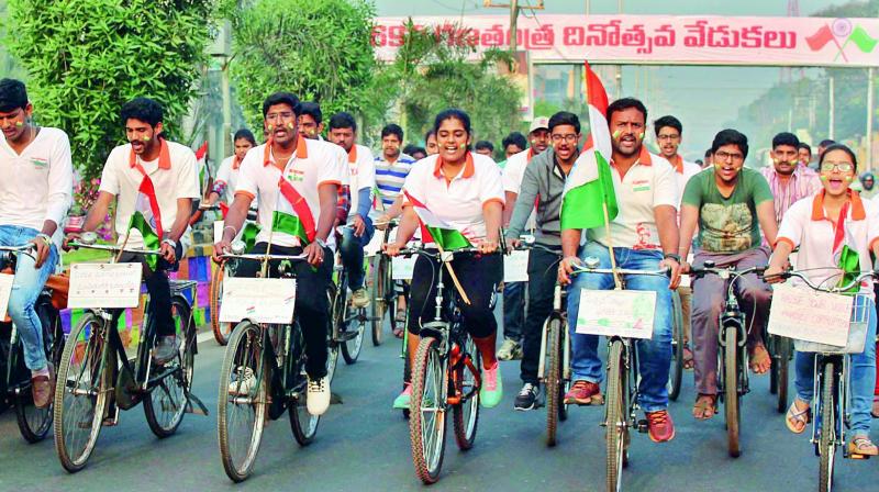 Members of Vivekananda Youth Association take out a cycle rally on the 69th Republic Day in Vijayawada. (Photo: DC)