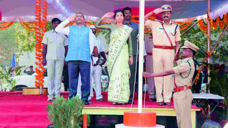 Collector Amrapali Kata, CP G. Sudheer Babu and joint collector S. Dayanand salute to the National Flag. (Photo: DC)
