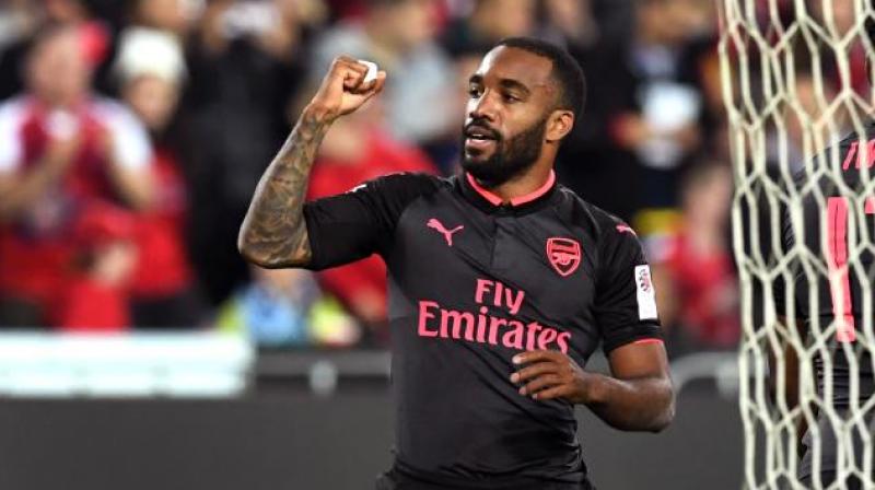 Alexandre Lacazette, who signed a 52.5 million ($68 million) deal from Lyon last week, came off the bench in the second half to score Arsenals second goal before more than 80,000 fans at Sydneys Olympic stadium.(Photo: AFP)