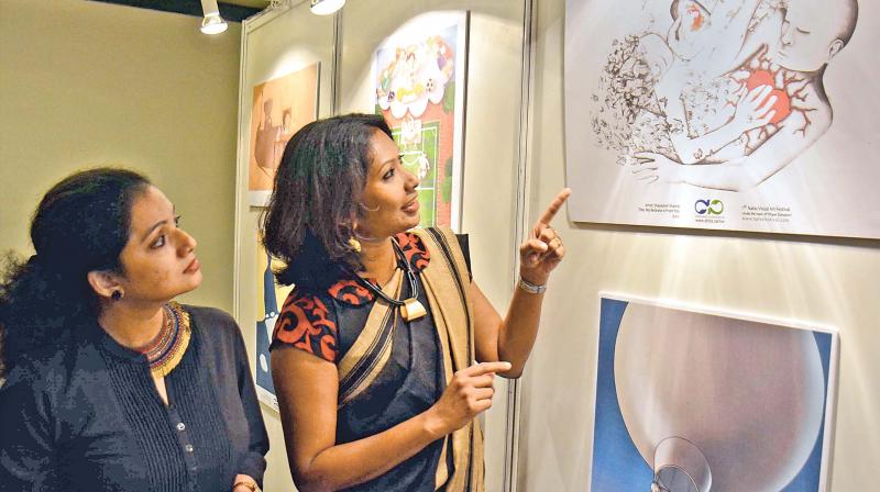 Participants of Indian Society of Organ Transplantations meeting admire a photo exhibition during the conference held in the city on Friday. (Photo: DC)