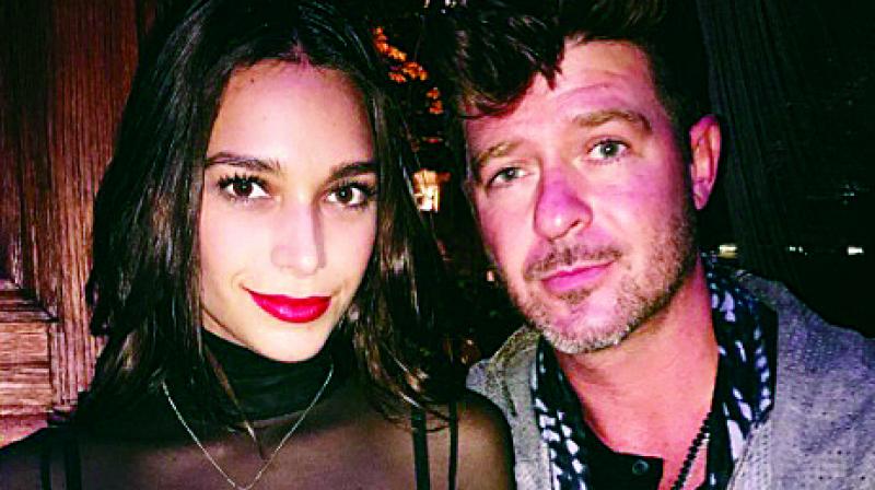 April Love Geary and Robin Thicke have an age gap of 18 years