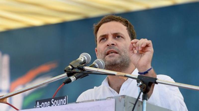 Congress vice president Rahul Gandhi, who had on Monday described GST as Gabbar Singh Tax during a rally in Gujarat, on Tuesday recalled a much quoted dialogue from Sholay to sharpen his attack on Prime Minister Narendra Modi. (Photo: PTI)