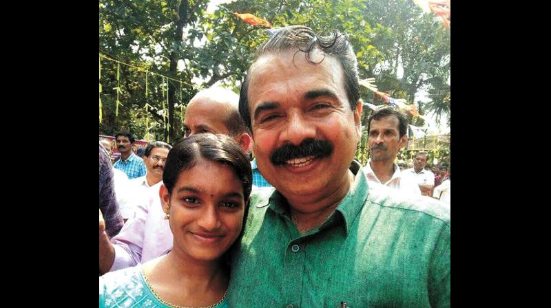 Sukanya posing for a photograh with Thaliparamba MLA James Mathew. (Photo: DC)