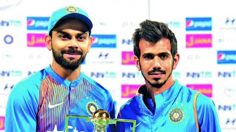 India captain Virat Kohli (left) and Yuzvendra Chahal pose with their trophies. (Photo: R. SAMUEL)