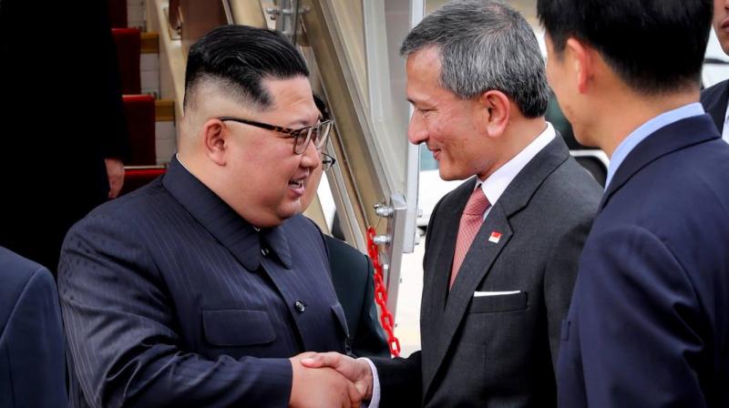 The city-states foreign minister Vivian Balakrishnan tweeted a picture of himself shaking hands with Kim at Changi Airport. (Photo: @VivianBala/Twitter)