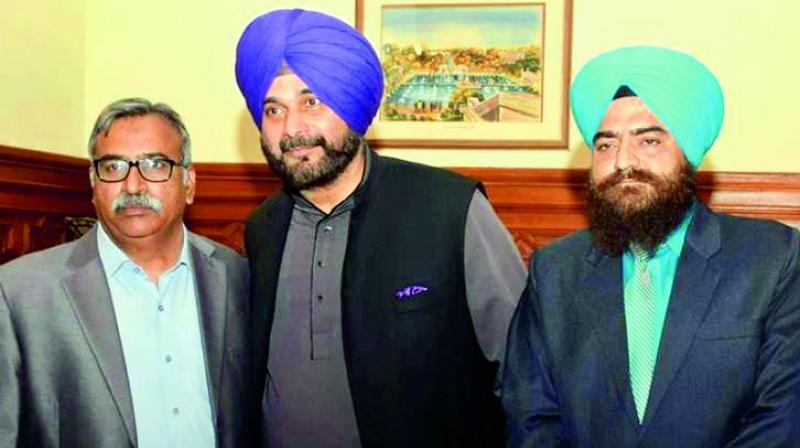 Navjot Sidhu (centre) with Gopal Singh Chawla (right) on the sidelines of the ceremony at Kartarpur.