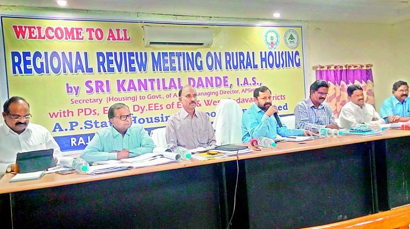 Andhra Pradesh State Housing Corporation Limited managing director Kantilal Dande addresses housing officials at a regional review meeting on rural housing in Rajahmundry on Thursday. 	 (DC)