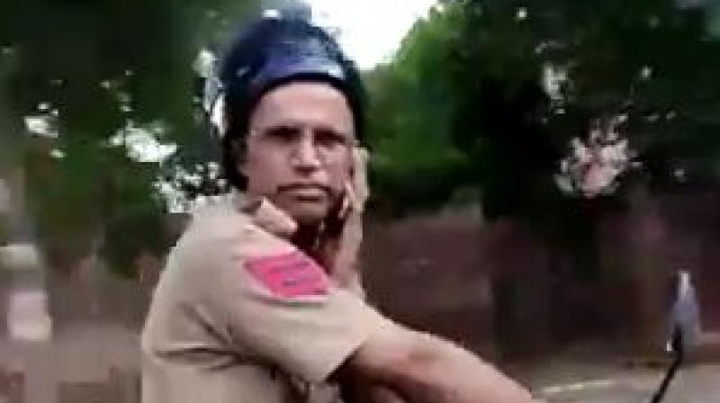 A video of head constable Surinder Singh slapping the local went viral on social media. He wasnt even wearing his helmet properly. (Photo: screengrab)