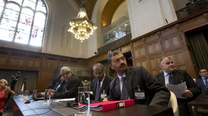 Dr Deepak Mittal, joint secretary of Indias Ministry of External Affairs, front row right, and his delegation wait for judges to enter the World Court in The Hague, Netherlands, Monday. (Photo: PTI)