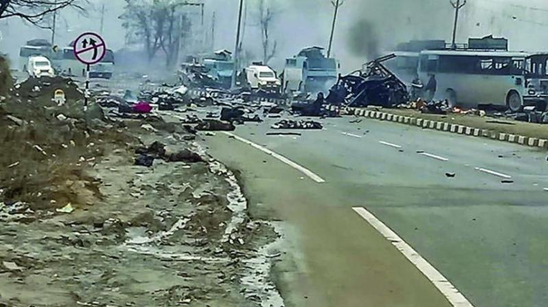 A scene of the spot after militants attacked a CRPF convoy in Goripora area of Awantipora town in Pulwama district of J&K on Thursday. At least 44 CRPF jawans were killed in the attack. (Photo: PTI)