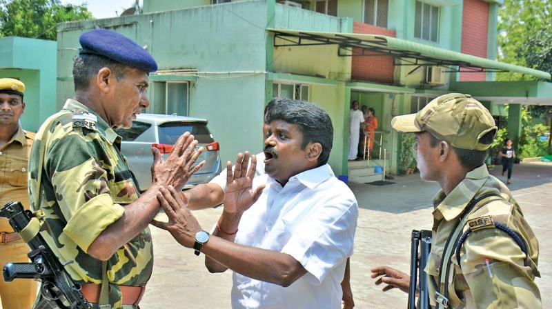 Central Reserve Police Force personnel impeded the state health minister C. Vijayabaskar from addressing the media in Chennai on Friday. (Photo: DC)