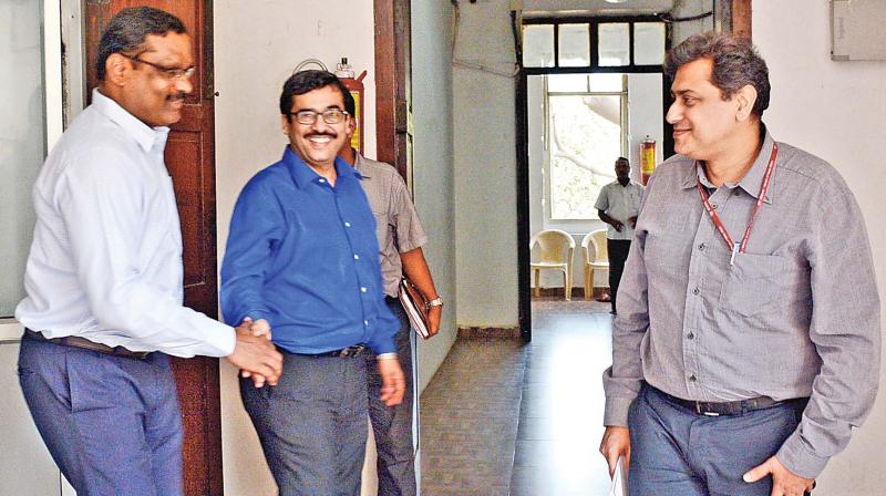 Rajesh Lakhoni, chief electoral officer of Tamil Nadu, and district election officer D. Karthikeyan meet Vikram Batra, special officer for RK Nagar byelections. (Photo: DC)