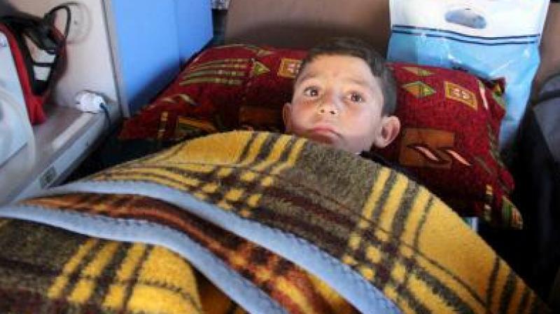 Abdel Basset was caught in a barrel bomb attack by regime forces on Thursday in the town of Al-Hbeit, in northwest Idlib province. (Photo: AFP)