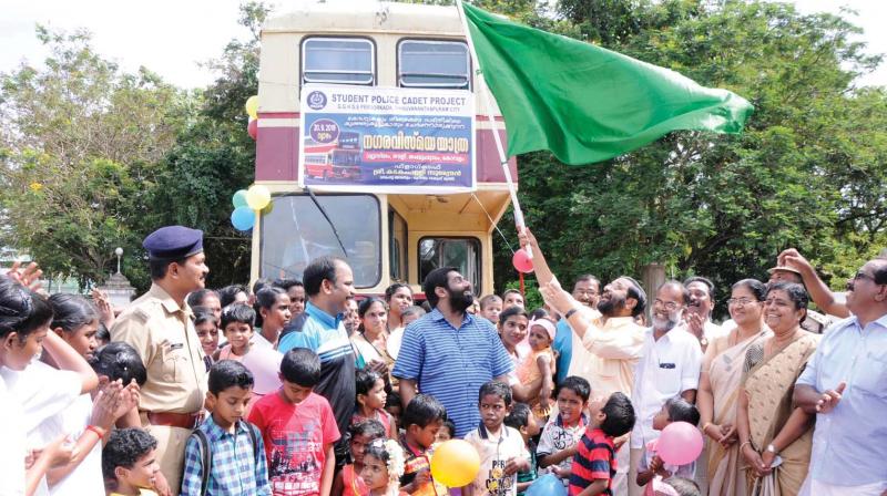 Tourism Minister Kadakampally Surendran  flags off the  double-decker bus ride for children, organised by Student Police Cadet Project and Kerala State Council for Child Welfare  in Thiruvananthapuram on Thursday. (Photo:A.V. Muzafar)