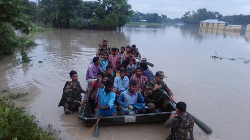 At least 14 people, including a minor were reported to have died due to second wave of floods, which has wreaked havoc in 19 out of 33 districts of the state. (Photo: DC/Manoj Anand)