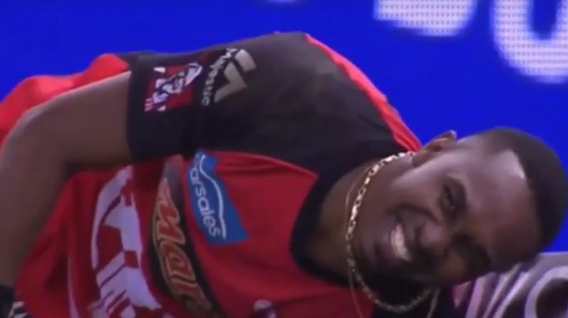 Dwayne Bravo was fielding on the boundary when he made a desperate dive to cut off a shot from Michael Klinger and clutched his hamstring in pain. (Photo: Screengrab)