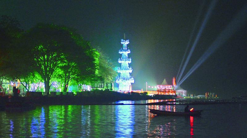 A view of the illuminated Bhavani island in the middle of the Krishna River in Vijayawada. (Photo: DC)