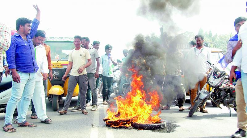 Activists burn tyres during AP bandh call given by Left parties and supported by the Congress and YSR Congress in Anantapur on Thursday. (Photo: DC)