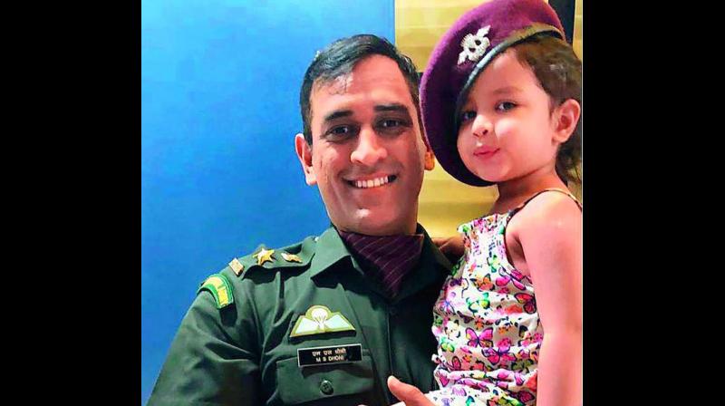 M.S. Dhoni with daughter Ziva after receiving the award.