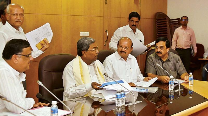 Primary and Secondary Education Minister Tanveer Sait, Chief Minister Siddaramaiah, and Law Minister T.B. Jayachandra at a meeting of the primary and secondary education department in Bengaluru on Friday (Photo: DC)