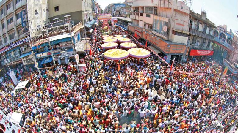 Thousands of devotees participate in the Tirupati Thirukudai procession by the Hindu Dharmartha Samiti on Thursday, in connection with the annual Brahmotsavam at Sri Venkateswara temple in Tirupati. (Photo: DC)