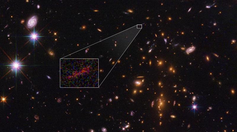Preliminary analysis suggests the diminutive galaxy weighs in at no more than 3 billion solar masses (credit: NASA)