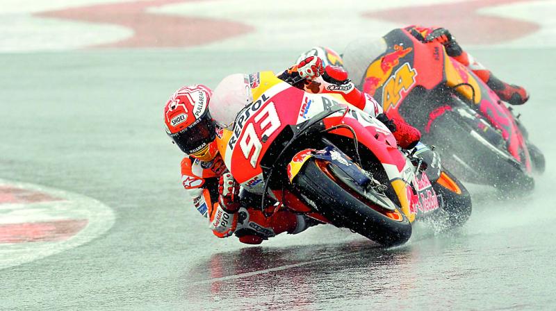 Honda rider Marc Marquez leads KTMs Pol Espargaro during the Motorcycle Grand Prix at the Ricardo Tormo circuit in Cheste near Valencia on Sunday.   (Photo: AP)