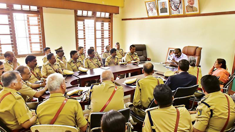 Chief Minister H.D. Kumaraswamy meets top police officers at his office in Vidhana Soudha on Thursday 	 (Photo; DC)