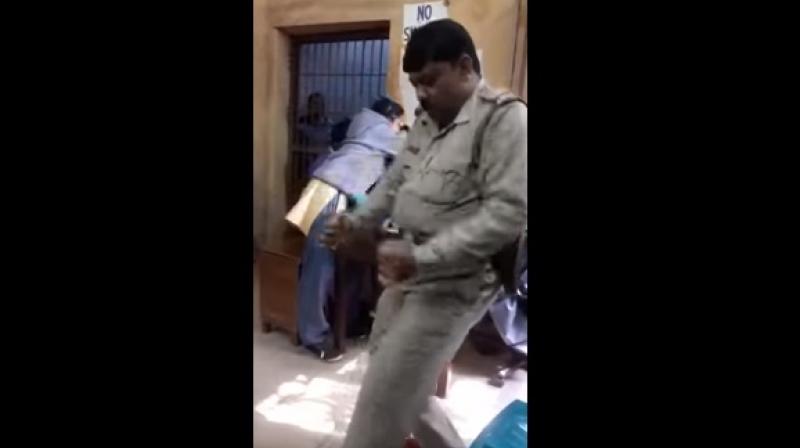 Mondal was celebrating his transfer to the Chittaranjan police station. (Photo: Youtube Screengrab)