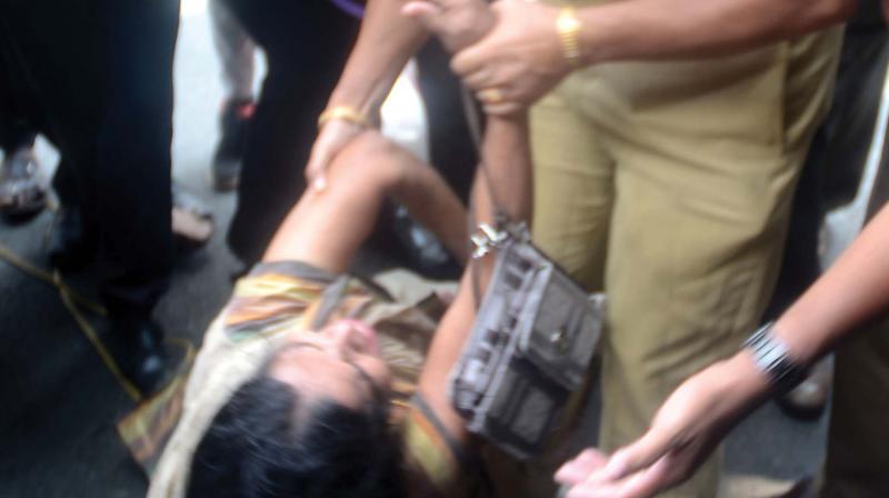 Police removes Mahija, mother of Jishnu Pranoy, who tried to stage an indefinite fast in front of the DGP office in Thiruvananthapuram on Wednesday. (Photo: Peethambaran Payyeri)