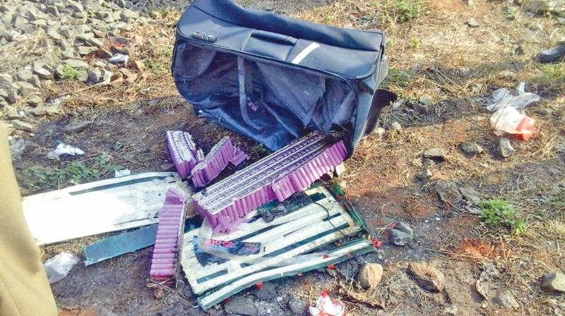 A bag containing 360 power bank batteries, two circuit boards and wire, was found with smoke emanating from it on railway track near Sanatorium railway station on Tuesday.(Photo: DC)