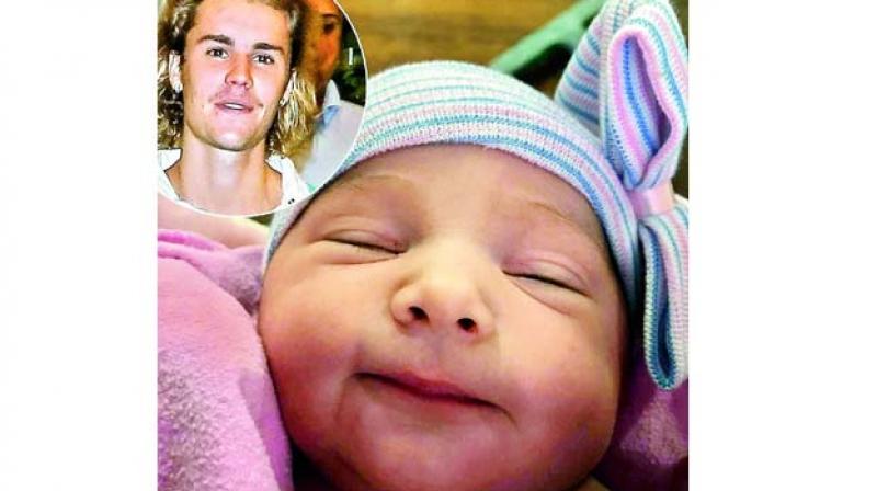 Justin Bieber with his baby sister