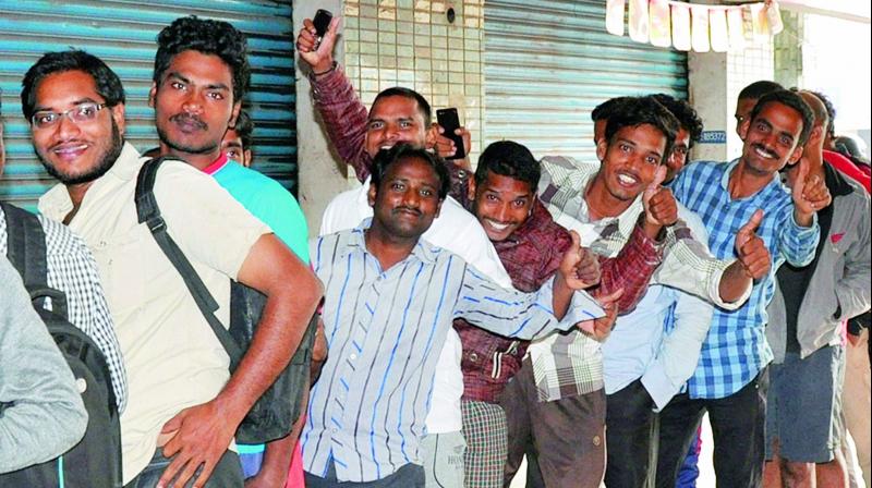 People stand in a queue to purchase tickets for the upcoming India-New Zeland ODI cricket match at an e-Seva centre in Visakhapatnam on Tuesday.