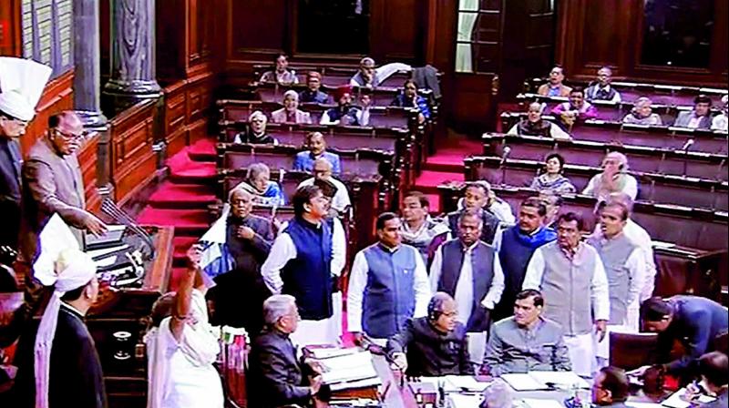 Deputy chairman P.J. Kurien conducts the proceedings as Rajya Sabha members protest over communal clashes at Kasganj, on Friday. (Photo: PTI)