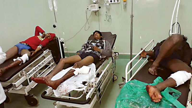 Some members of the gang, who were shot at by the police, being treated at a city hospital on Friday. (Photo: DC)