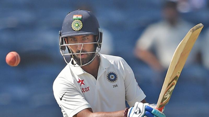 After KL Rahuls fine half-century, Cheteshwar Pujaras fifty made sure India did not throw in the towel in the second innings of the second Test against Australia in Bengaluru. (Photo: PTI)
