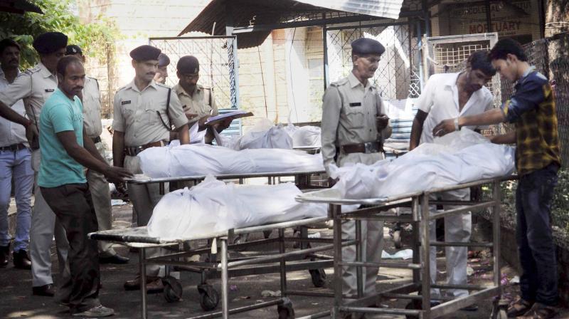 Bodies of SIMI terrorists who were killed in an encounter after they escaped from Central Jail, being handed over to their relatives and family members after post-mortem in Bhopal. (Photo: PTI)