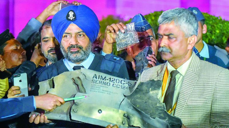 IAF officials show sections of an exploded Amraam missile, said to be fired by Pakistan Air Force F-16s. They said Pakistani aircraft package which was part of the Wednesdays operation comprised F-16s and JF 17s and perhaps some Mirages and that India countered them with Mig 21 Bisons, Mirage 2000s and Sukhoi 30s.	 PTI