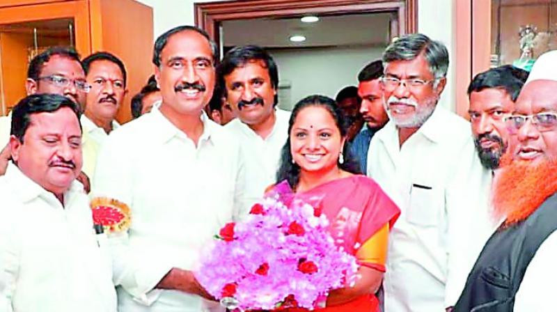 Nizamabad MP and TRS leader K. Kavitha receives bouquet from her well-wishers on Thursday after her partys victory in Telangana Assembly elections.
