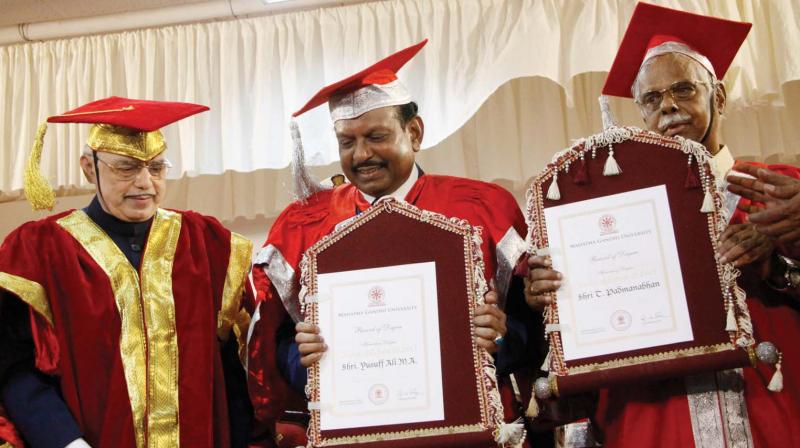 Governor  P.Sathasivam  with  NRI entrepreneur M. A. Yusuff Ali and writer T. Padmanabhan  after  conferring  honorary degree of doctor of letters (D.Litt.) on them at the 7th special convocation organised by the MG University at Athirampuzha in Kottayam on Thursday. (Rajeev Prasad)